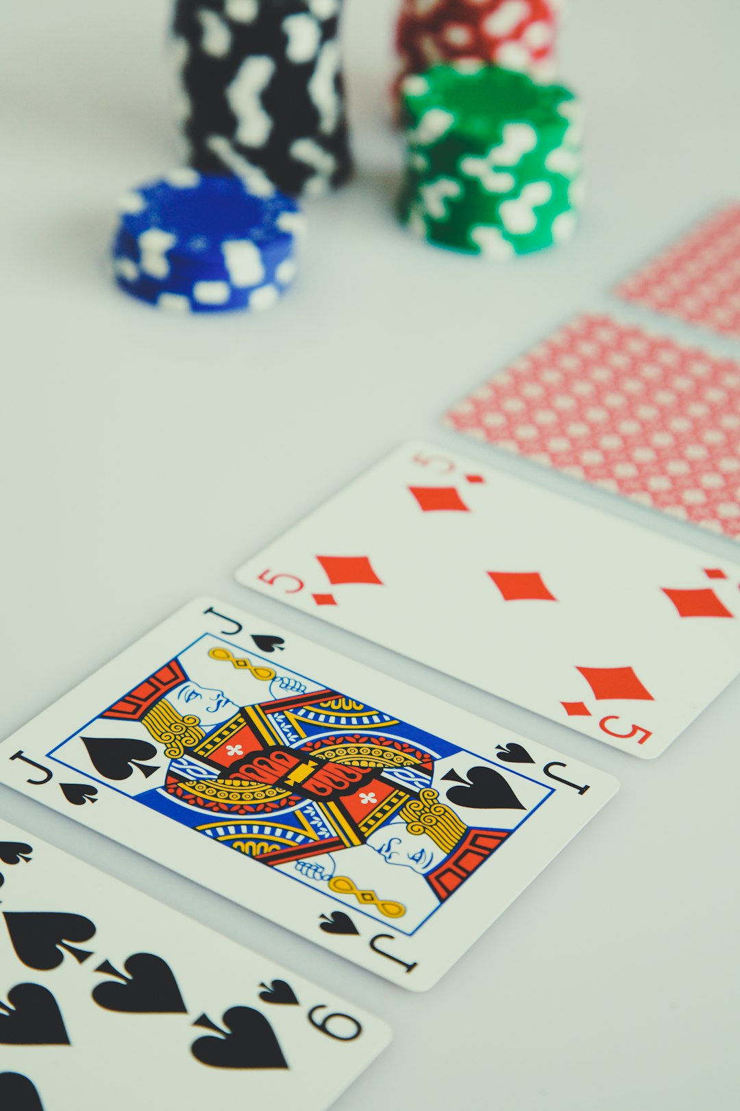 gallery-02 assorted-playing-cards-on-white-surface-khurolbgbq8